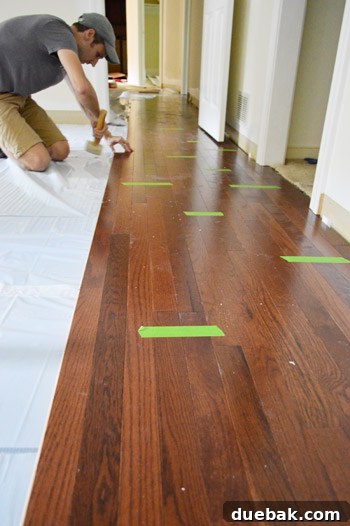 Elevate Your Space: A Seamless Guide to Oak Hardwood Flooring 12 Tapping Hardwood Planks into Place