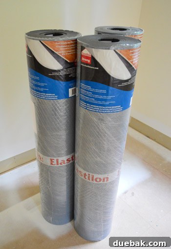 Elevate Your Space: A Seamless Guide to Oak Hardwood Flooring 7 Rolling Out Elastilon Underlayment