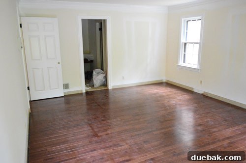 First completed room with new hardwood floors, still dusty
