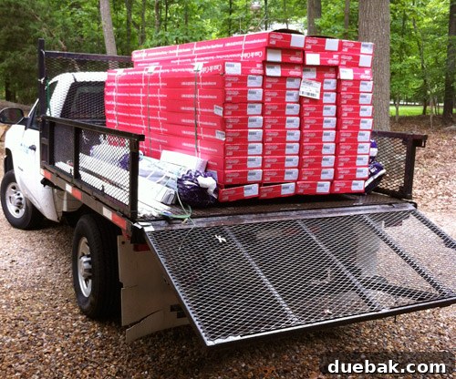Massive stack of hardwood flooring boxes on a forklift