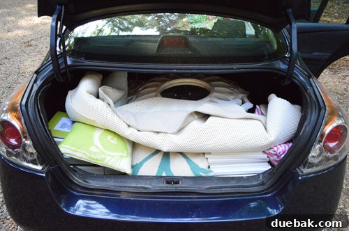 Third Home, First Footprint 15 Efficiently packed car interior on moving day, showcasing the thoughtful use of space for personal belongings