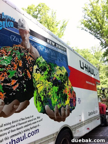 Third Home, First Footprint 17 U-Haul truck with a 'Jersey' license plate prominently displayed, symbolizing good luck for the move