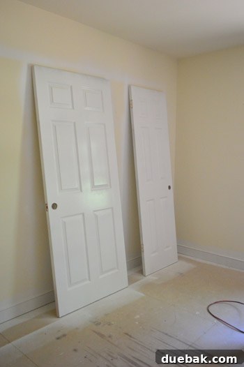 Freshly painted white door in an upstairs hallway