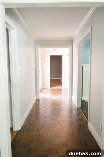 Closing the Chapter on Our Second Home 5 Empty hallway, cleared of framed photos, showcasing the clean walls