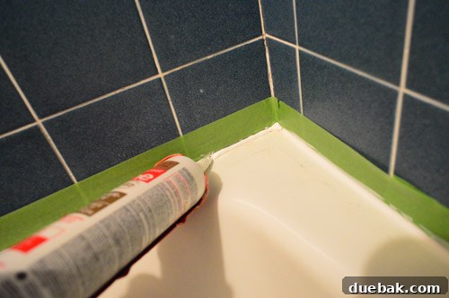 Ditch Your Outdated Sliding Shower Door 16 Fresh caulk applied with tape for clean lines