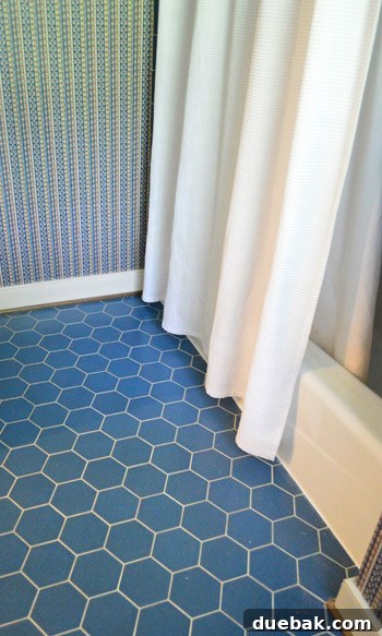 Ditch Your Outdated Sliding Shower Door 19 Transformed bathroom with new caulk and shower curtain