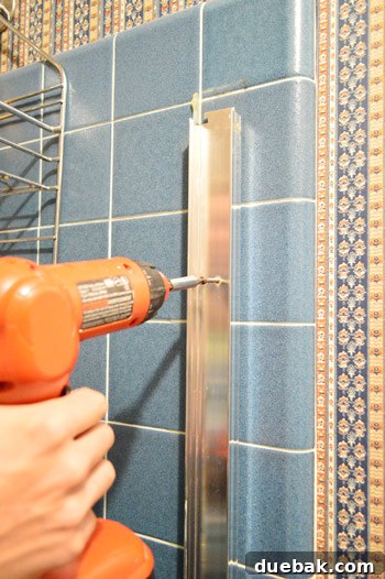 Ditch Your Outdated Sliding Shower Door 6 Removing screws from side shower door frame