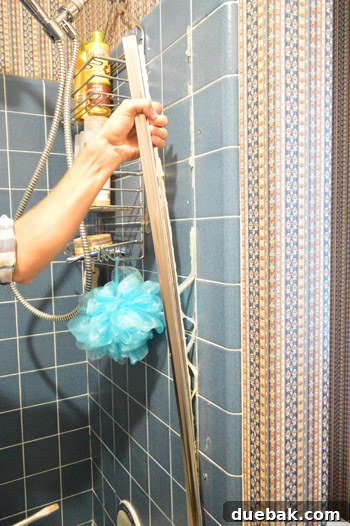 Ditch Your Outdated Sliding Shower Door 8 Removed shower door frame coated with old caulk