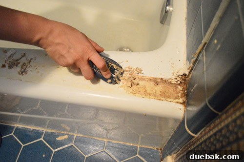 Ditch Your Outdated Sliding Shower Door 9 Thick layer of scum and mildew under removed shower door frame