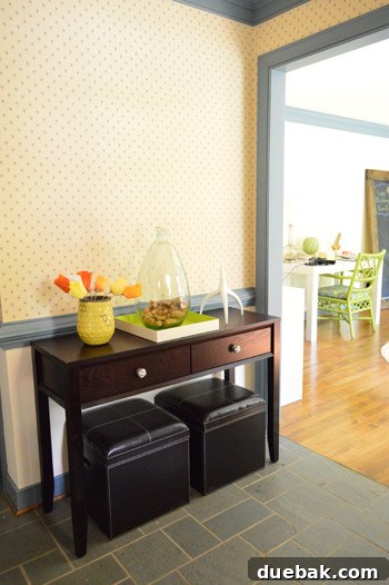 Wide shot of the office revealing areas needing more work, including blue trim and wallpaper.