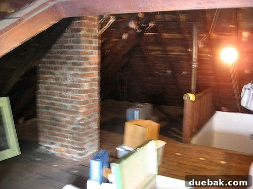 unfinished-attic-makeover-transformation-renovation Unfinished attic before makeover. This image captures the raw, dusty, and unutilized state of the attic before renovation began, highlighting its potential for transformation.