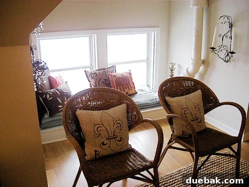 finished-attic-makeover Finished attic makeover. This image showcases the beautifully transformed attic space, now a comfortable and stylish 'hangout room' with modern amenities.