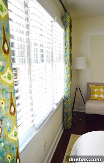 Effortlessly Install White Faux Wood Window Blinds 12 Guest room with faux wood blinds and custom-sewn curtains, creating a layered window treatment