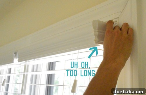 Effortlessly Install White Faux Wood Window Blinds 7 Close-up of a faux wood blind's side trim pieces needing adjustment