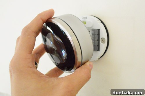 Nest thermostat faceplate installed on the wall