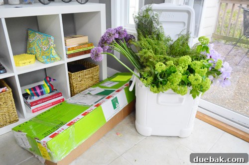 The HGTV Effect 17 Sunroom filled with boxes of fresh flowers for a photoshoot
