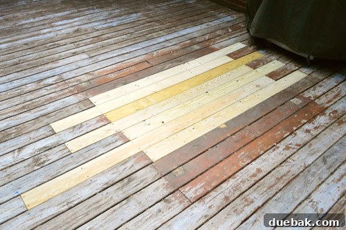 Patched hole in wooden deck