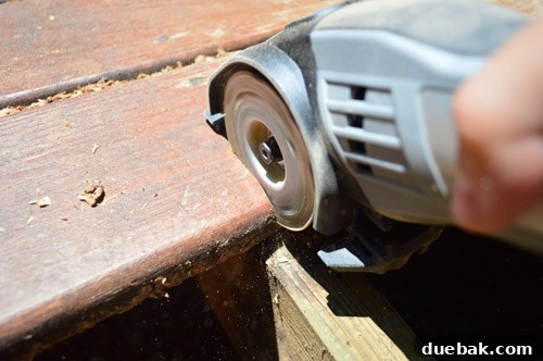 Dremel Sawmax tool using to cut deck board