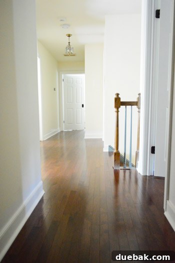 First Chapter 33 Stairway after renovation, with new flooring and painted trim.