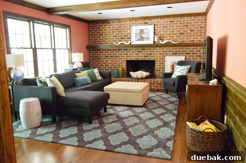 First Chapter 10 Living room with salmon walls and temporary furniture arrangement.