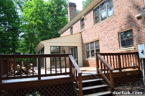 Before photo of the sunroom, showing an all-cream exterior