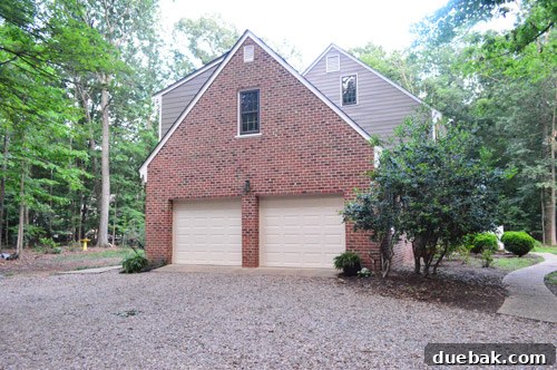 Garage doors before painting, showing existing color