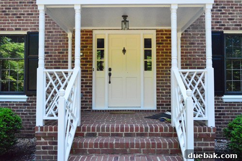 Front door and sidelights before painting, showing existing color