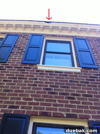 Damaged wood trim showing signs of rot and decay