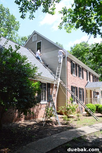 Close-up of exterior house siding after repair and initial painting