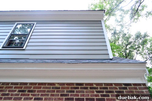 Front exterior view of a freshly painted house, showcasing new colors and curb appeal