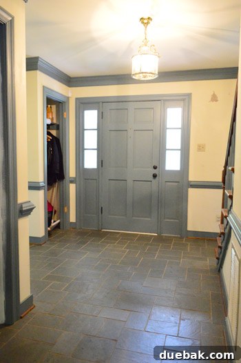 Hand-Painting Trim for a Professional Finish 2 Foyer with blue trim before renovation