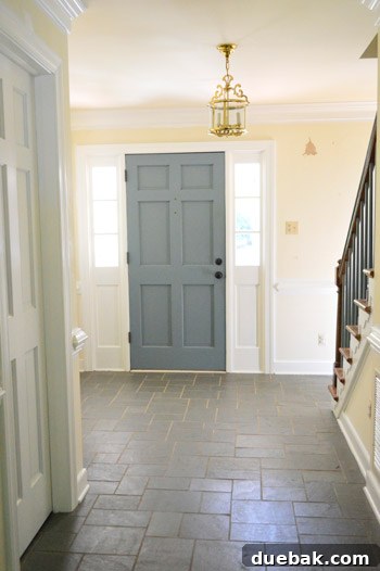 Hand-Painting Trim for a Professional Finish 8 Foyer with stairs and newly painted white trim