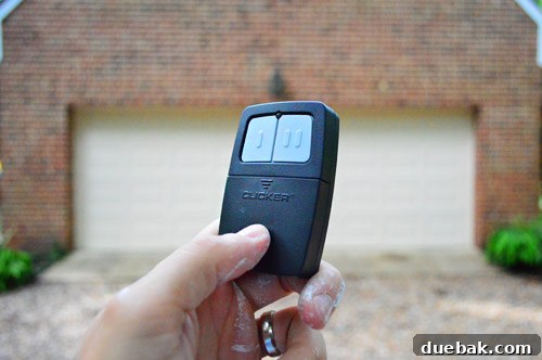 A dog, Burger, sitting next to a garage door, implying ease of use