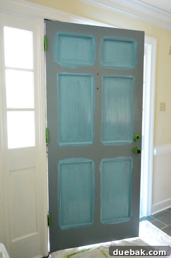 The Bold Secret Behind Your Front Door 5 Step-by-step door painting technique, highlighting panel and frame work