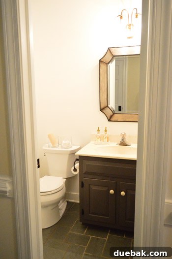 Wider shot of the improved half bathroom