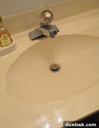 Close-up of a leaky bathroom faucet