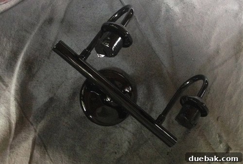 DIY painted light fixture in oil-rubbed bronze before adding shades