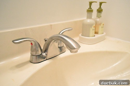 DIY Bathroom Faucet Replacement 11 Newly installed brushed nickel faucet with two handles in the half bathroom