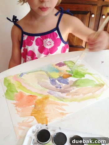 Heartfelt Artistry 3 Clara, a budding young artist, joyfully immersed in painting with watercolors, capturing her natural creativity.