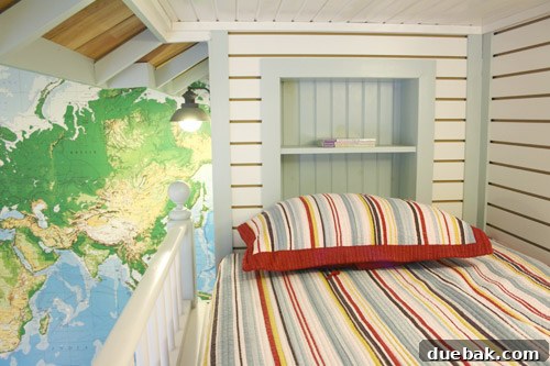 Globetrotter's Den: Map Wallpaper and Bunk Beds for Young Explorers 4 Close-up of the cedar shake roof on the bunk bed loft, showcasing the detail