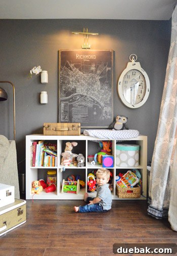 Townhouse Takeover: Unleashing Cozy Creativity 6 Luke's charming play area featuring an Ikea bookcase, vintage map, oversized clock, and DIY white painted mason jars.