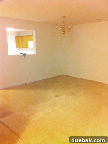 Townhouse Takeover: Unleashing Cozy Creativity 7 Before photo of the living room, a blank canvas awaiting transformation.
