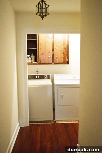 Laundry nook with old carpet and appliances, ready for an aesthetic and functional upgrade