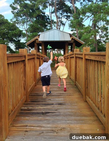 Children playing together on a family beach vacation in Destin, Florida
