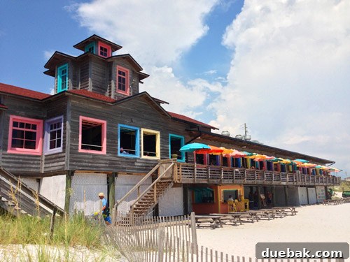 Pompano Joe's restaurant on Destin beach with vibrant blue and yellow colors