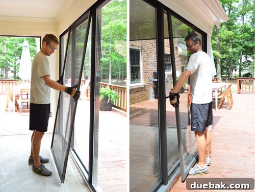 Removing the first set of heavy sliding glass doors from the sunroom openings