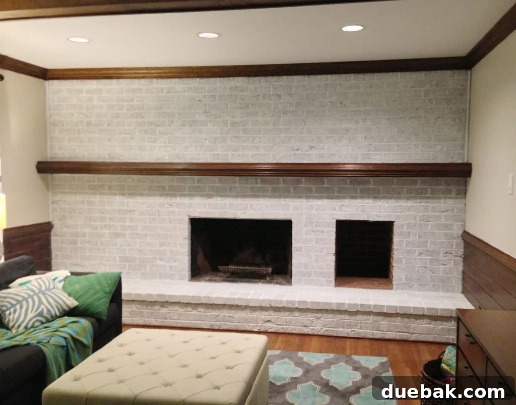 DIY Whitewashing: Transform Your Brick Fireplace 11 A darker whitewash technique applied to a brick wall fireplace using two coats of highly diluted white paint, achieving a textured, muted finish.