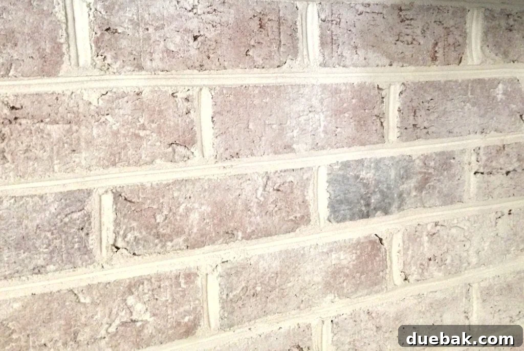 DIY Whitewashing: Transform Your Brick Fireplace 12 Close-up detail of a beautifully whitewashed brick fireplace with a DIY treatment, highlighting the nuanced texture and brighter tone.
