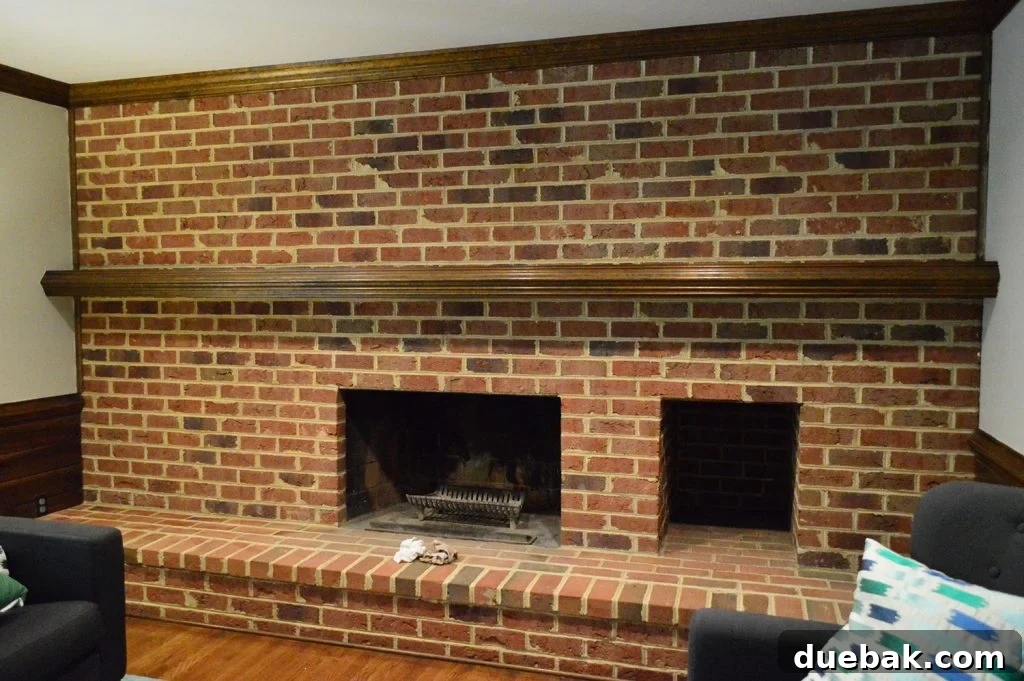 DIY Whitewashing: Transform Your Brick Fireplace 5 A dark and dated living room brick wall with a fireplace, typical of a 1980s home, awaiting its whitewash transformation.