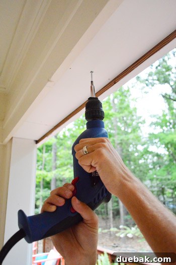 Securing overhead trim with screws for added support and long-term stability